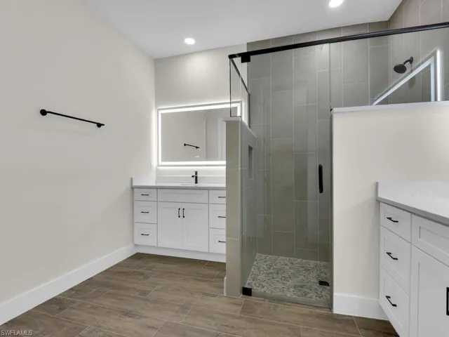 Bedroom featuring wood finished floors and a ceiling fan