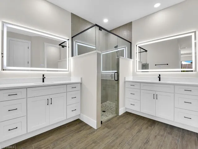 Walk in closet featuring wood finish floors