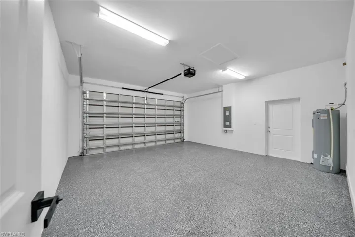 Garage with water heater and electric panel