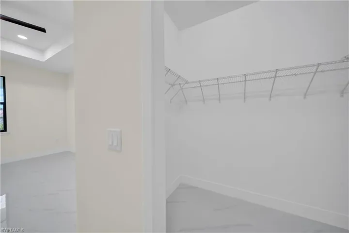 Spacious closet with marble finish flooring