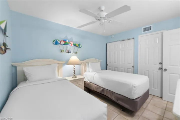 Bedroom featuring ceiling fan and light tile patterned floors