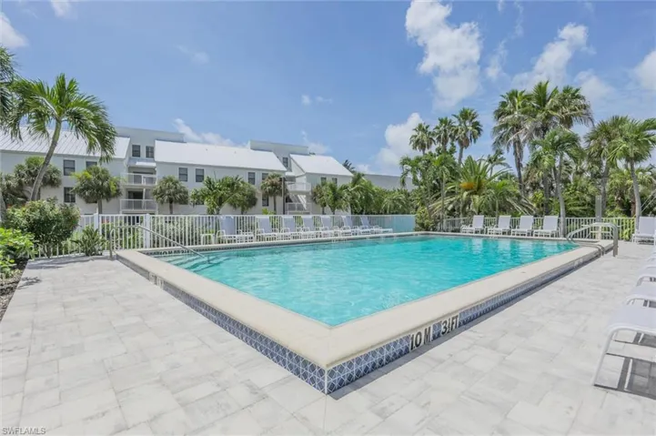 Community pool with a patio area