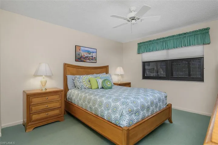 Bedroom with carpet flooring and a ceiling fan