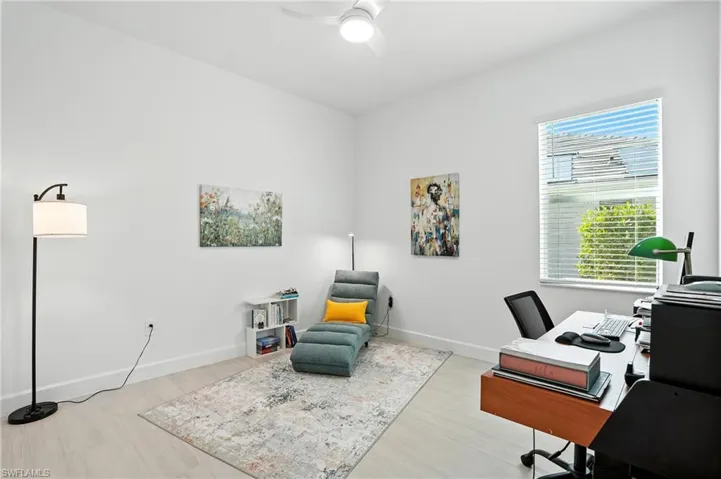 Office featuring a ceiling fan and light wood-style floors