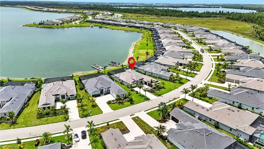Aerial perspective of suburban area with a large body of water