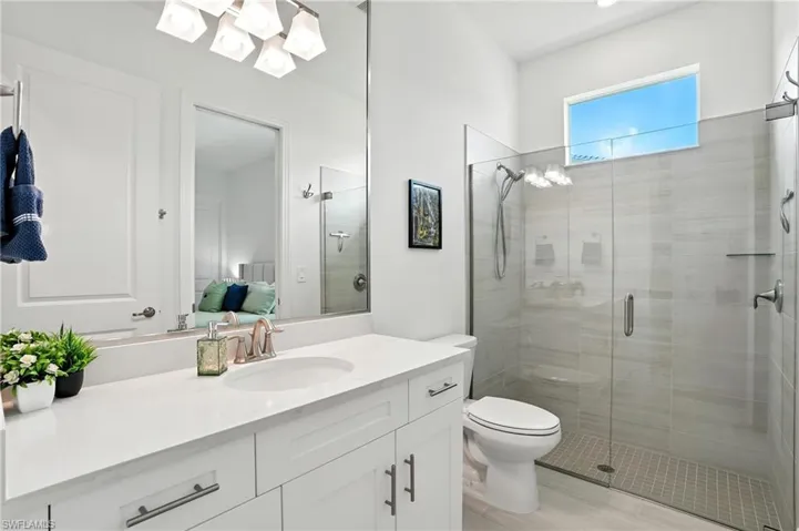 Ensuite bathroom with vanity and a shower stall