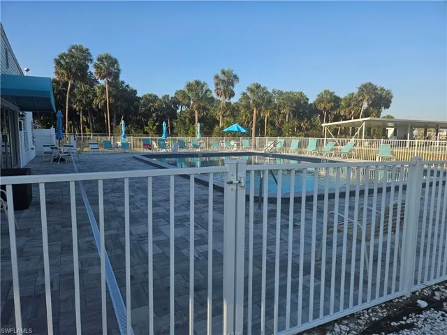 Community pool featuring fence