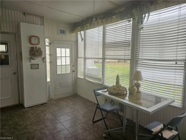 Sunroom featuring visible vents