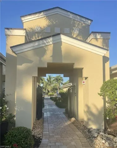 Entrance to property with stucco siding