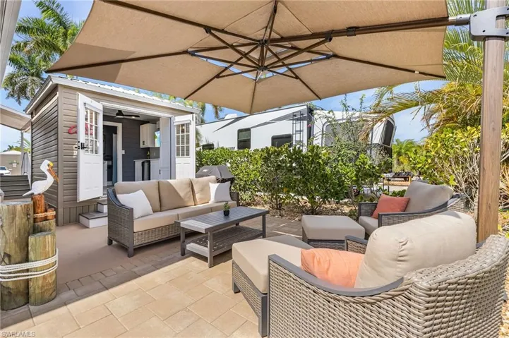 View of patio with outdoor furniture and an outdoor structure