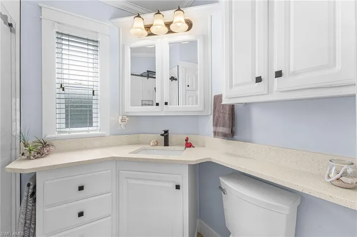 Bathroom with vanity and ornamental molding