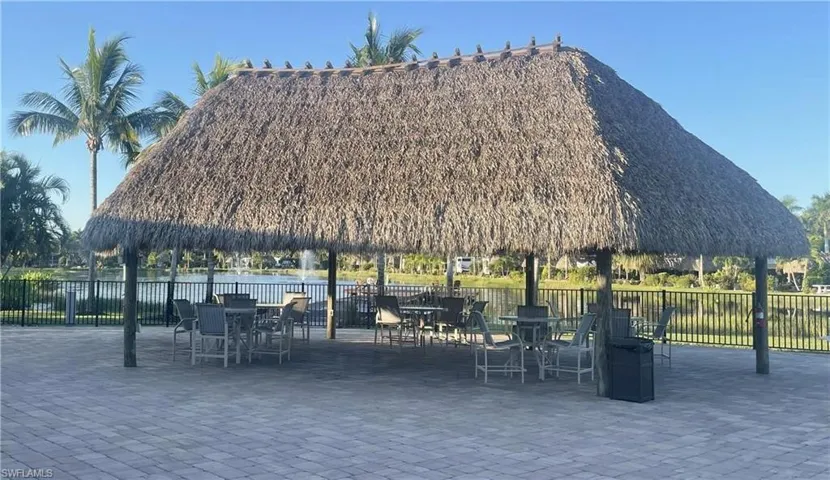 View of community with a patio area and outdoor dining area
