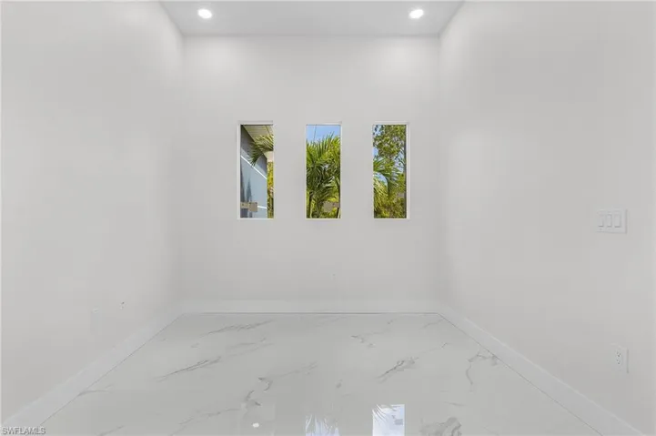 Unfurnished room featuring tile patterned flooring