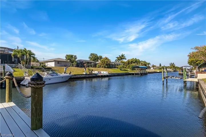 Dock featuring a water view and boat lift