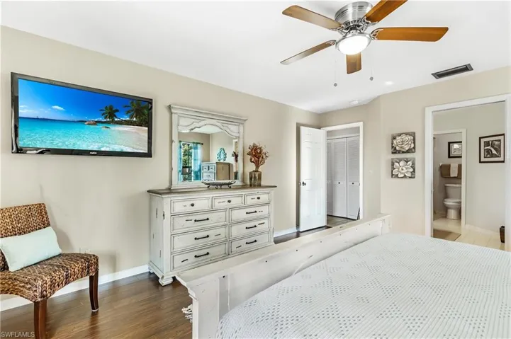 Bedroom featuring dark wood-style flooring and ceiling fan