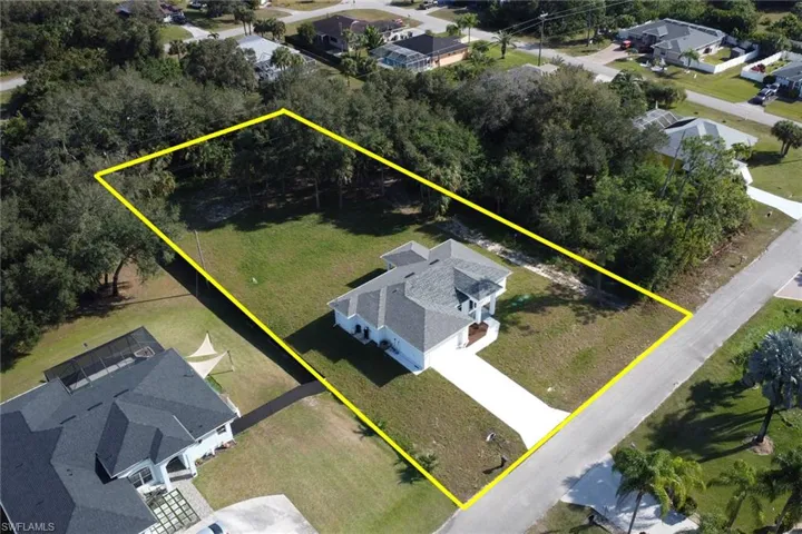 Aerial perspective of suburban area with property parcel outlined