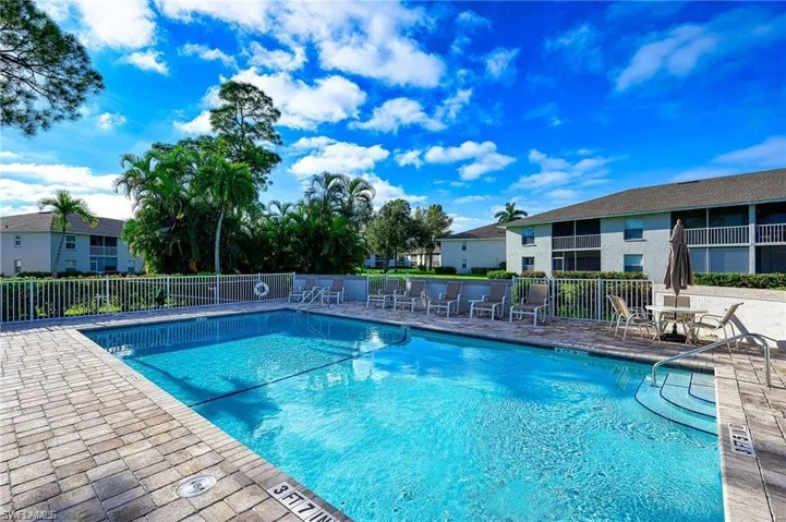 Community pool featuring a patio