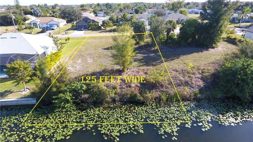 Aerial view of residential area with property boundaries highlighted