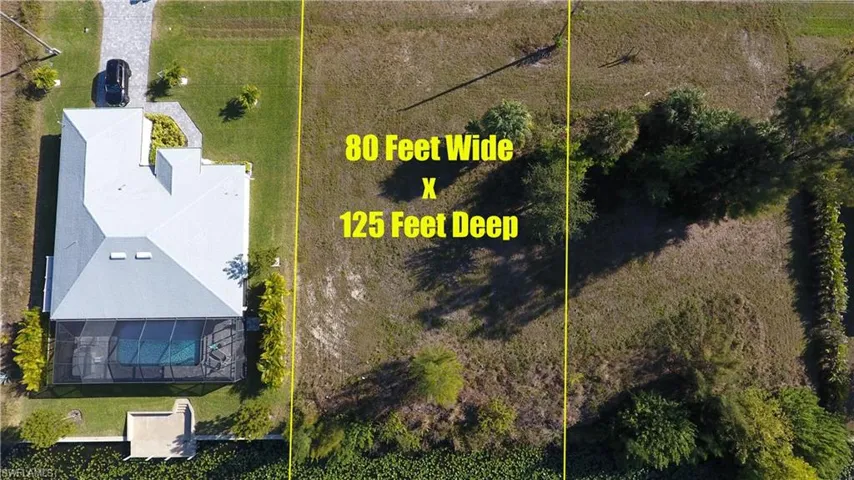 Aerial view of property and surrounding area with property parcel outlined