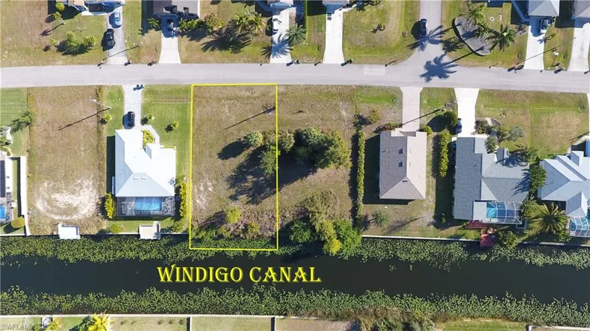 Aerial view of residential area featuring property boundaries highlighted