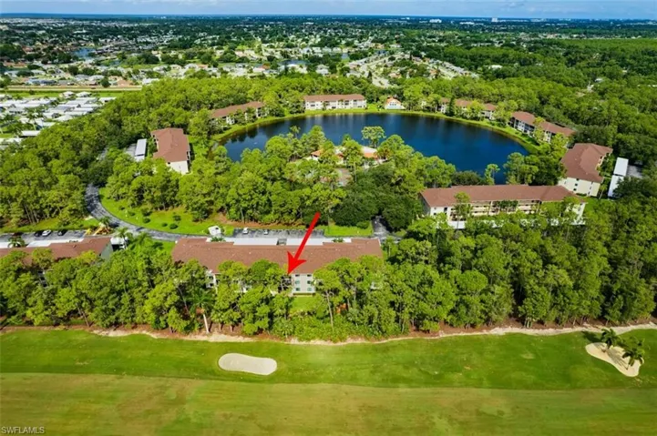 Birds eye view of property featuring a water view