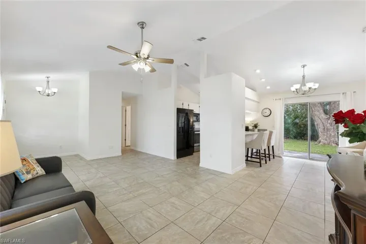 Living room with vaulted ceiling.