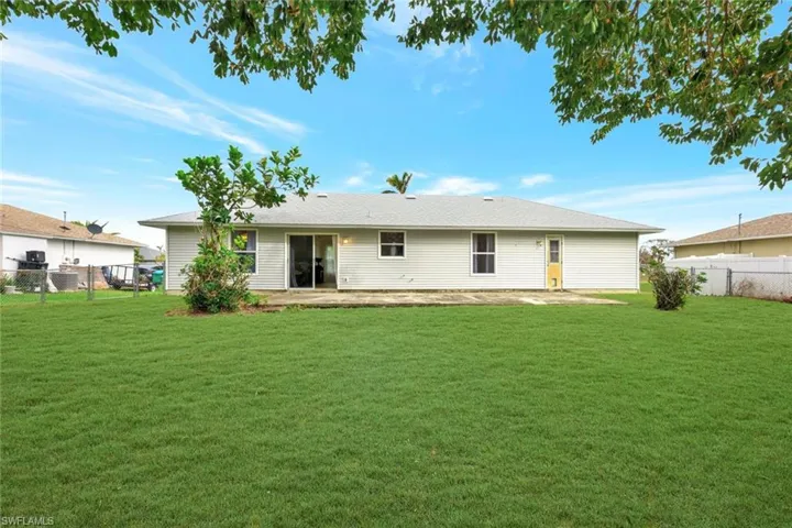 Rear view of home and patio