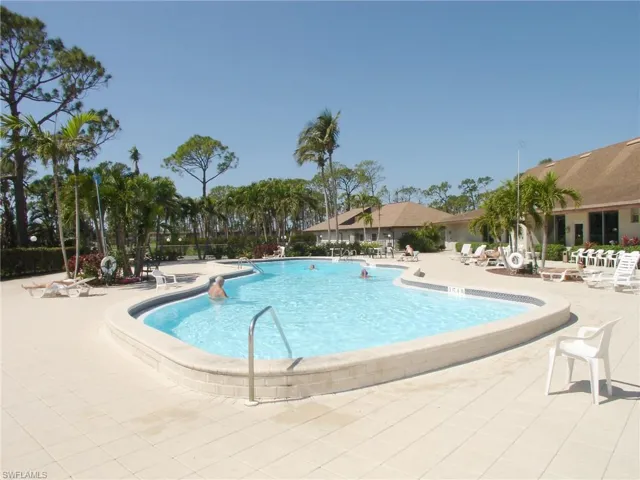 Community pool featuring a patio