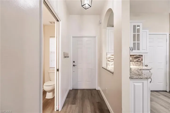 Doorway featuring light wood-type flooring