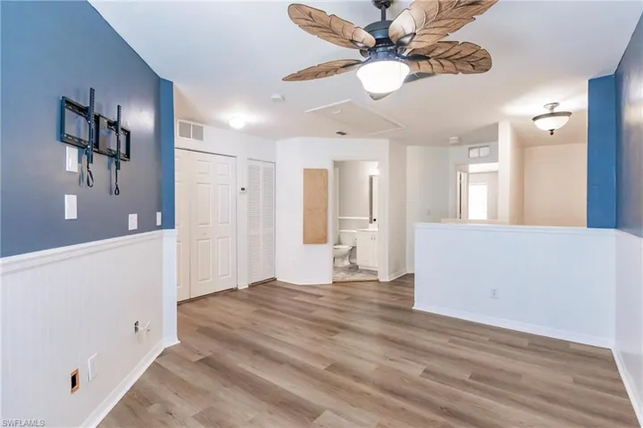Empty room featuring ceiling fan and light hardwood / wood-style flooring