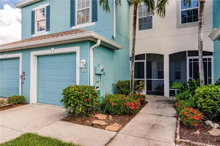 View of front facade featuring a garage