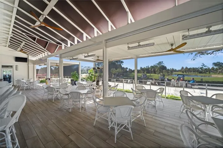 Deck featuring ceiling fan, outdoor dining space, and a water view