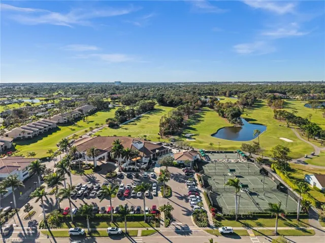 Bird's eye view of a golf course and a nearby body of water