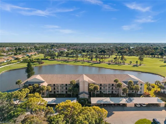 Drone / aerial view of a golf club and a large body of water