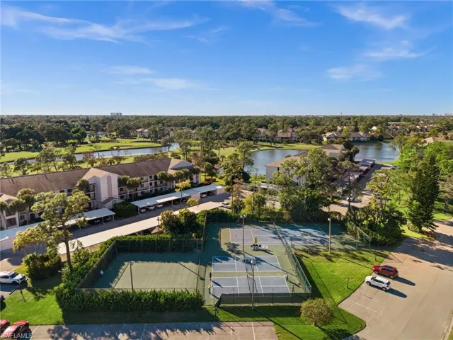 Aerial perspective of suburban area with a nearby body of water