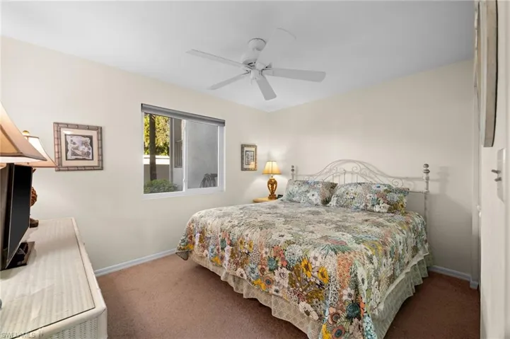 Bedroom featuring carpet floors and ceiling fan