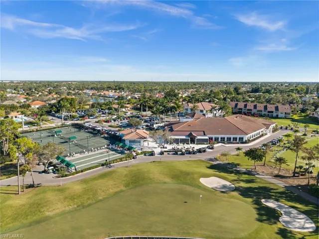 Aerial view of residential area featuring a local golf course