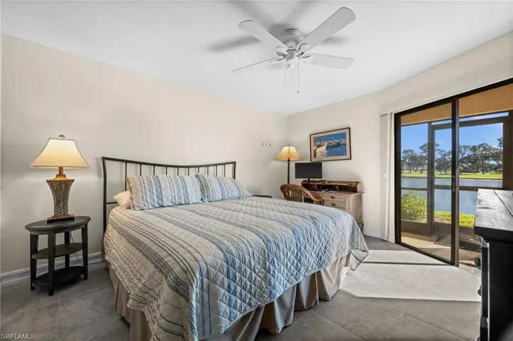 Bedroom with access to outside and ceiling fan