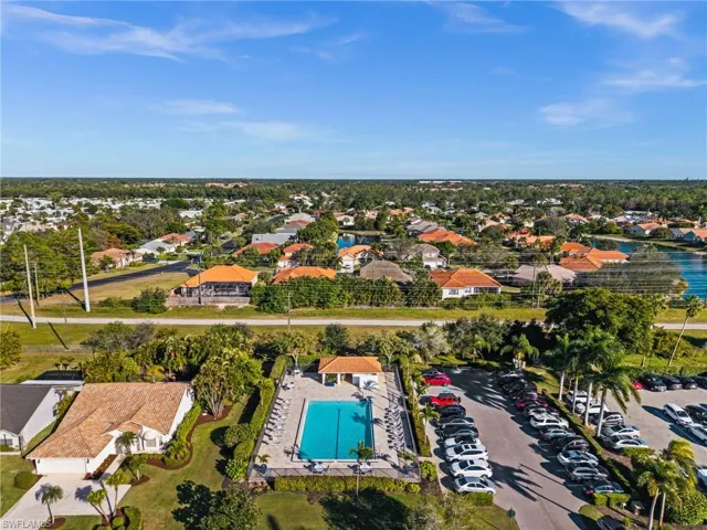 View of property location featuring nearby suburban area and a pool area