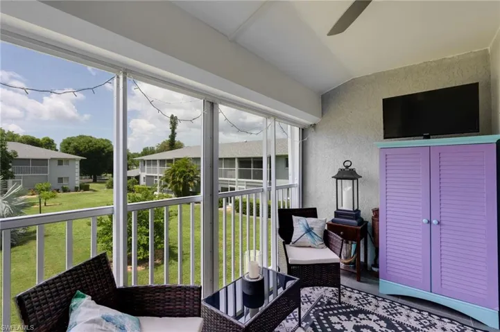 Screened Patio with electric hurricane shutter