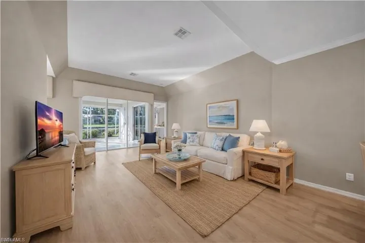 virtually staged Living area featuring light wood-style flooring