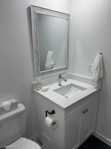 Bathroom with vanity and toilet