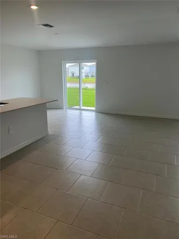 Spare room with recessed lighting and light tile patterned floors