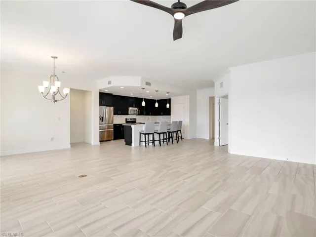 Great Room With Living Area, Dining Area & Kitchen And Crown Molding