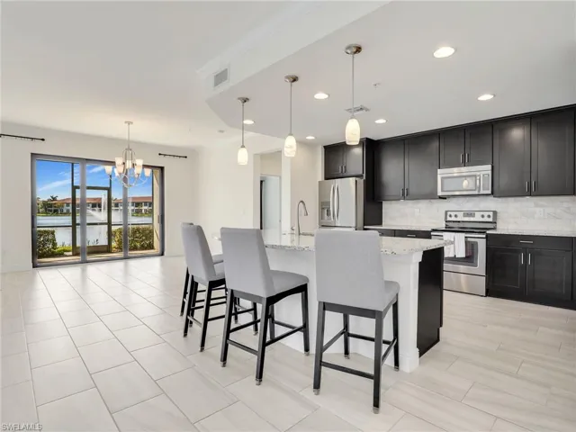 Kitchen & Dining Area With Sliders To Lanai