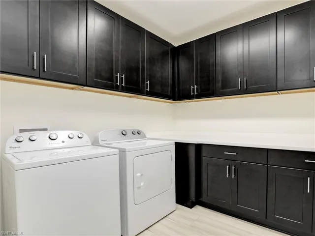 Spacious Laundry Room With Tons of Upper & Lower Cabinets, Washer, Dryer & Large Counterspace