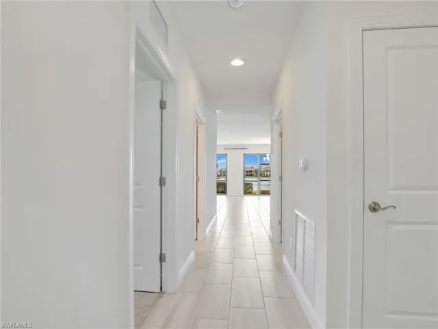 Hallway With Doors To Laundry Room, Utility Closet, Guest Bedroom, Guest Bathroom & Storage Closet