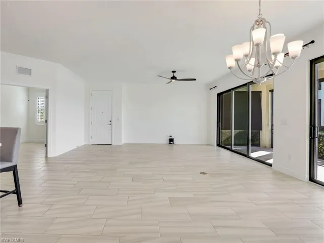 Tiled Living Area With Door To Entrance & Door To Den