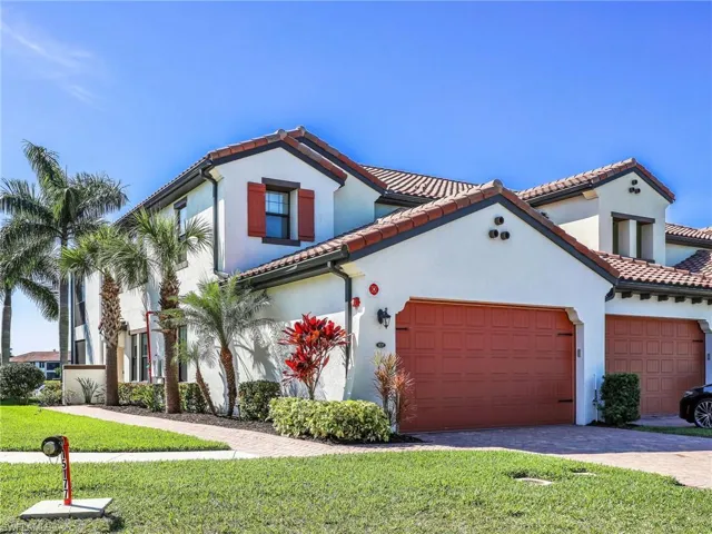Front Of Building W/ 2 Car Garage & Paver Driveway