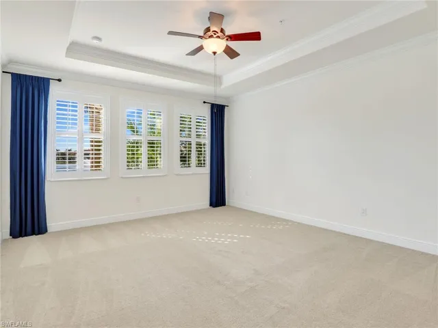 Primary Bedroom With Tray Ceiling With Crown Molding